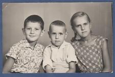 Portrait of beautiful two boys and girl with long pigtail. Soviet Vintage Photo